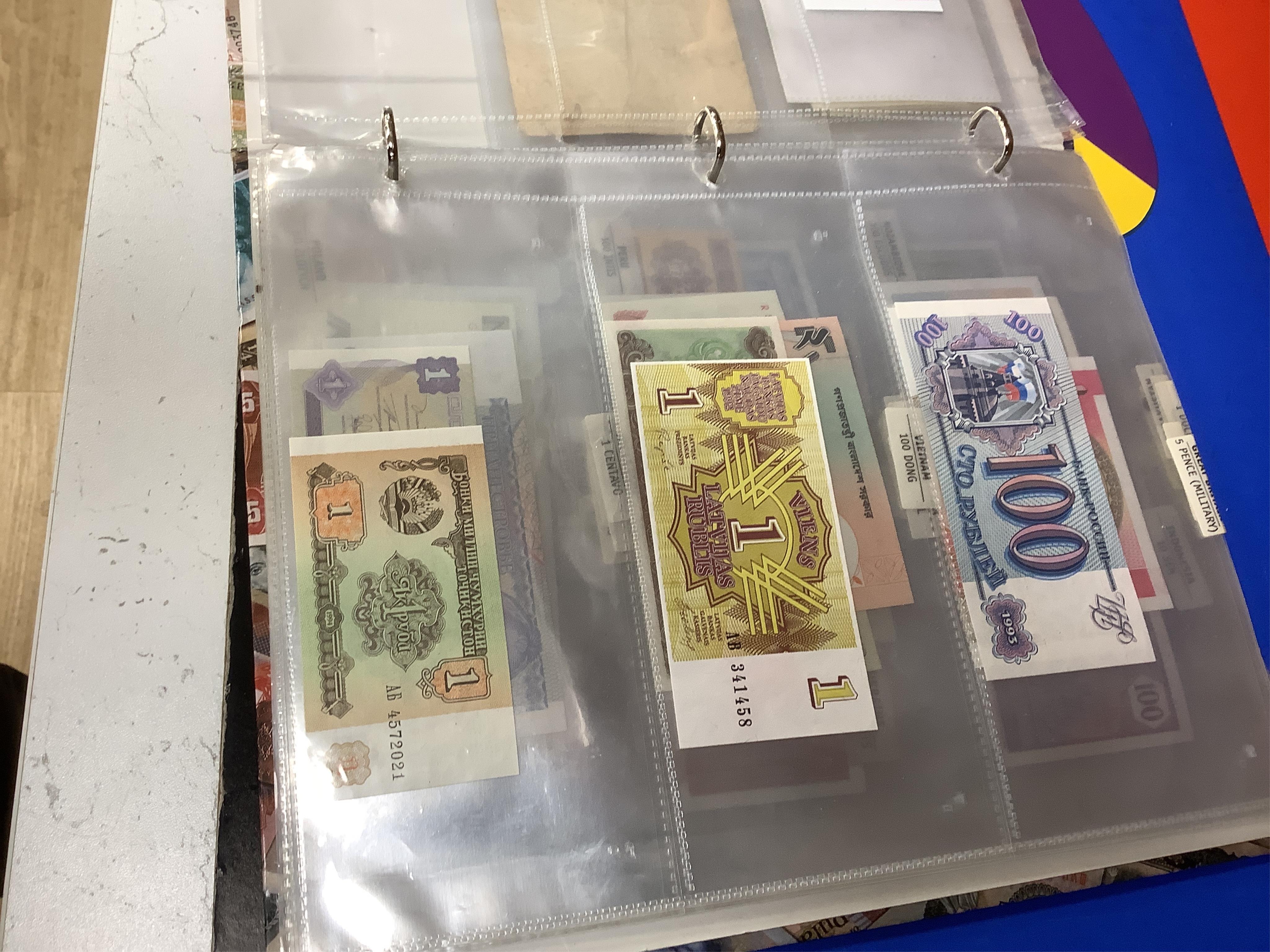 World coins and banknotes, including ‘crowns of the world’ Bermuda, Canada South Africa etc some may be replicas, in three albums, together with examples in clear plastic wallets the majority 1950 or later